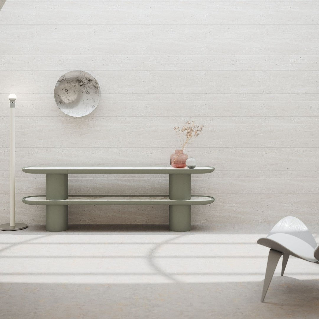 Modern green console table with smooth, rounded edges and a sleek, minimalistic design against a textured neutral backdrop.