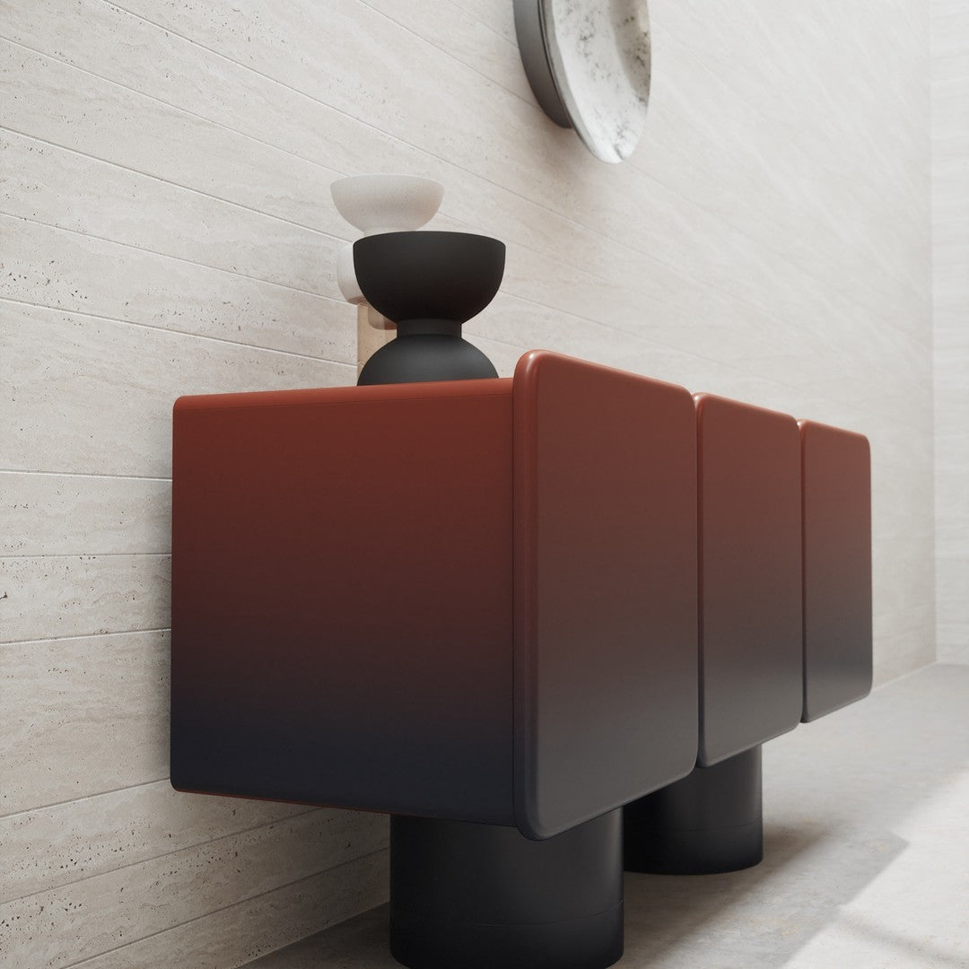 Modern cabinet featuring a gradient from deep red to black, with smooth lines and a sleek black base.