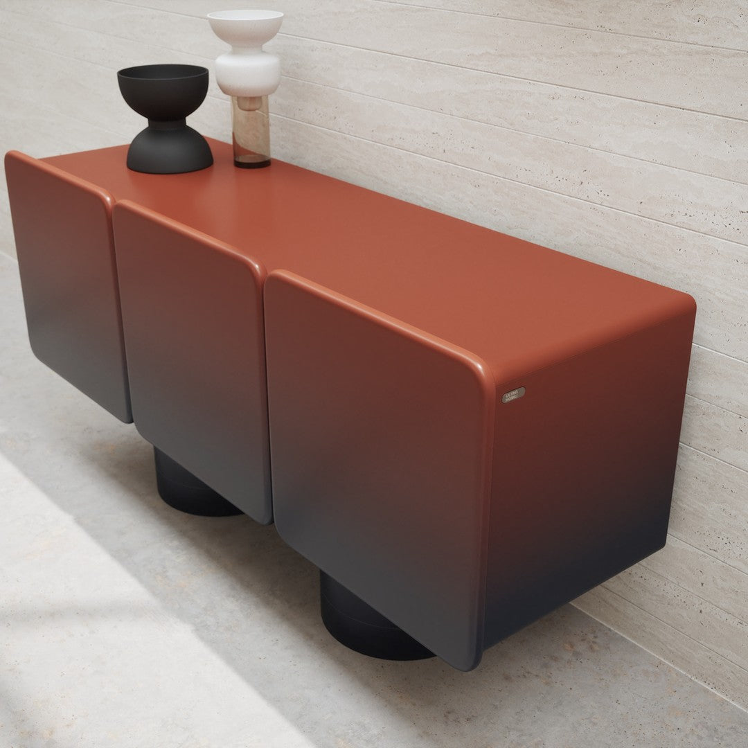 Modern three-drawer console in rust orange with gradient black accents, featuring a sleek, matte finish.