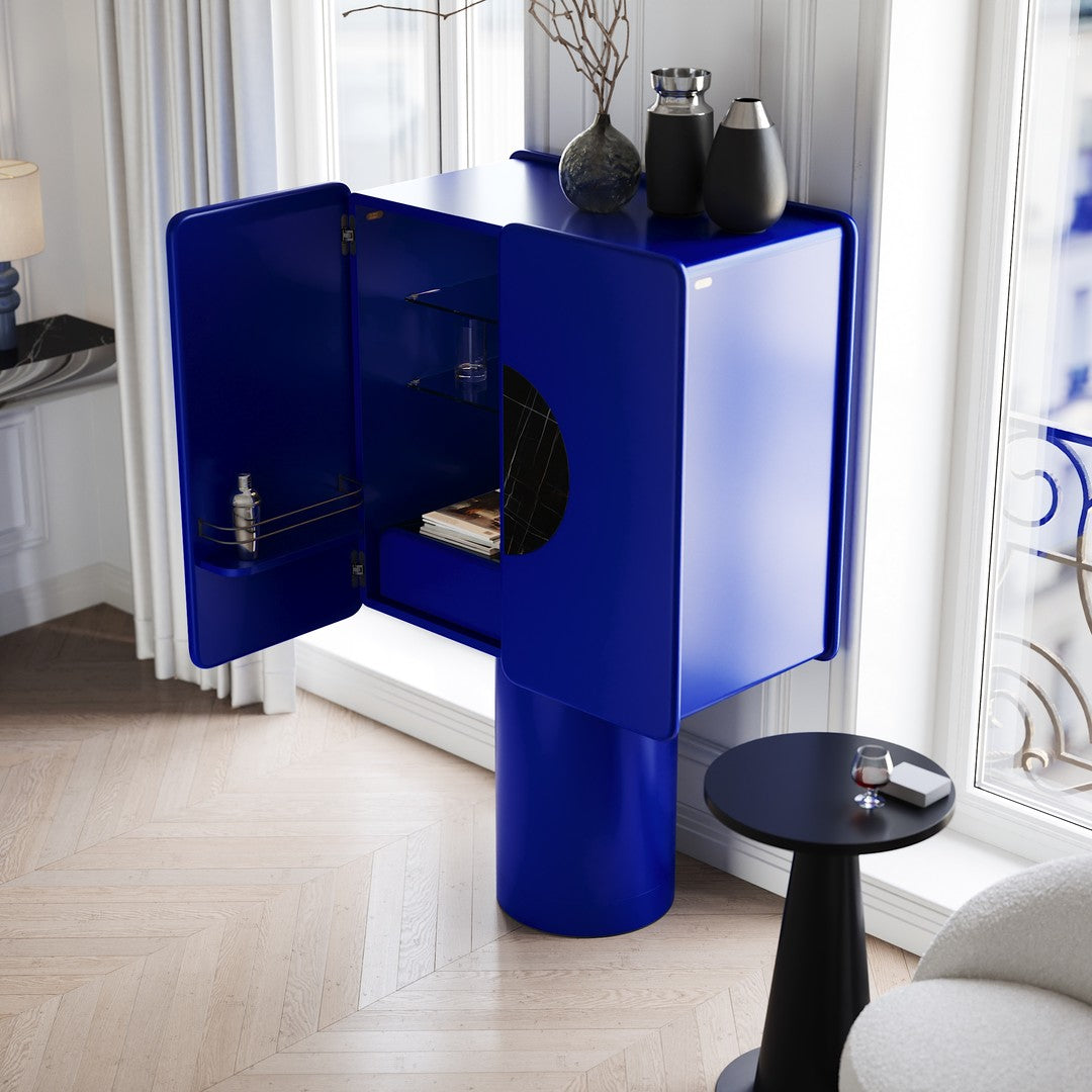 Bold blue cabinet with glossy finish, round base, and modern geometric design, perfect for contemporary interiors.