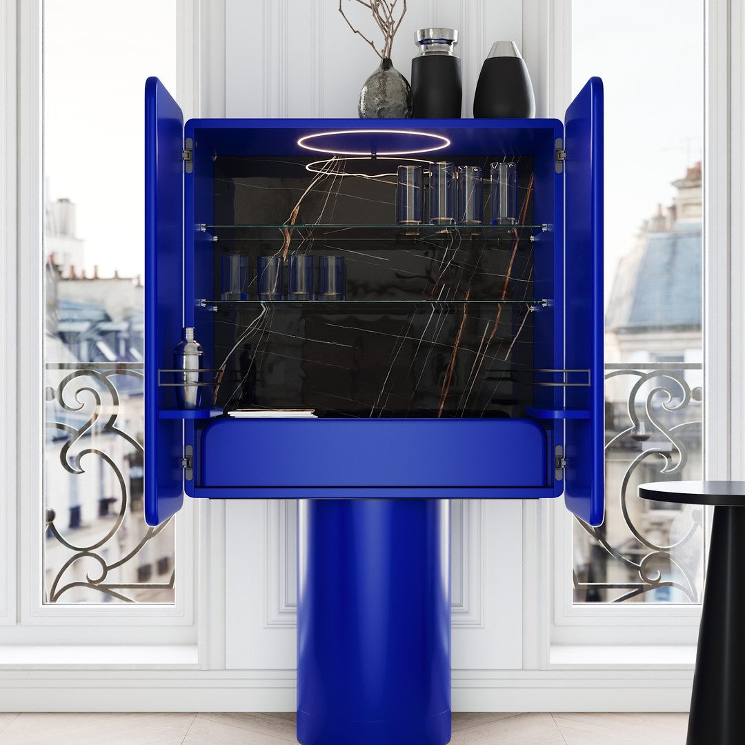 Vibrant blue cabinet with sleek black interior and reflective accents, featuring modern minimalist design.