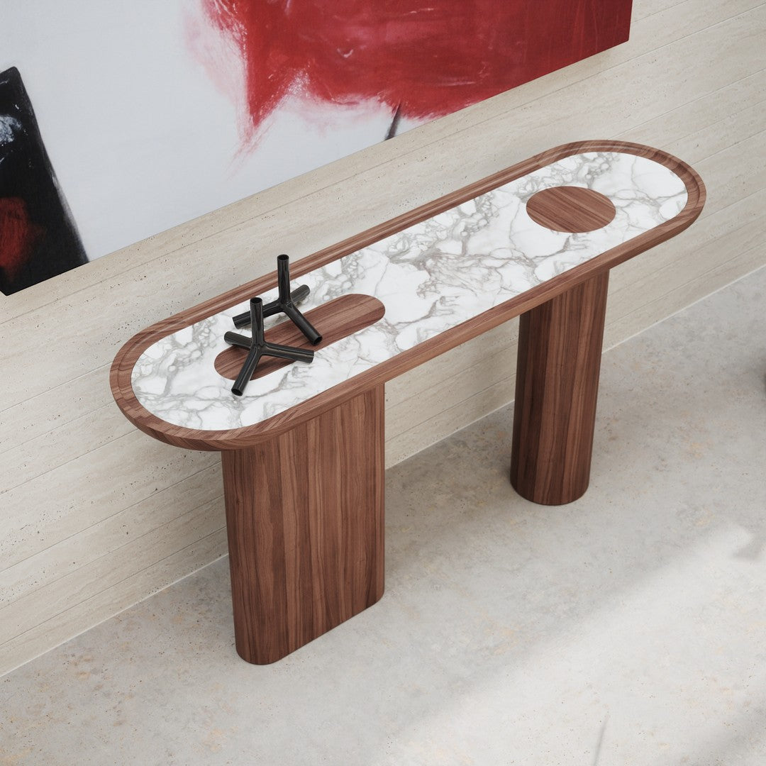 Elegant wood console table featuring a white marble top with dark veining and circular accents. Modern design elements.