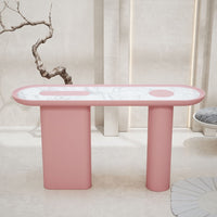 Pink and white oval console table with smooth surfaces and stylish circular patterns.