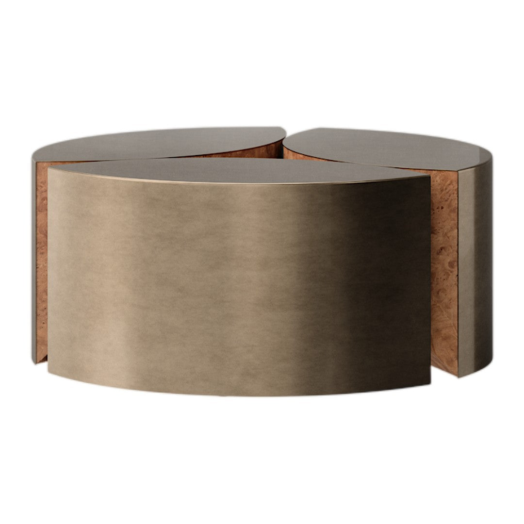 Brushed bronze coffee table with curved design and natural cork accents, offering a modern and elegant look.