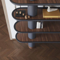 Wooden bookshelf with dark gray curves and brown shelves, featuring a sleek modern design and herringbone floor pattern.