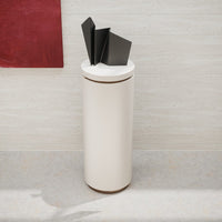 Stylish cream-colored container with black geometric lid, perfect for modern decor accents.