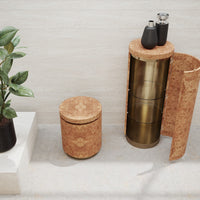 Cork and golden metallic storage set with circular and cylindrical shapes, enhancing modern decor.