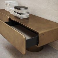 Gold and black drawer unit with a smooth metallic finish and minimalist design. Stylish and modern home decor.