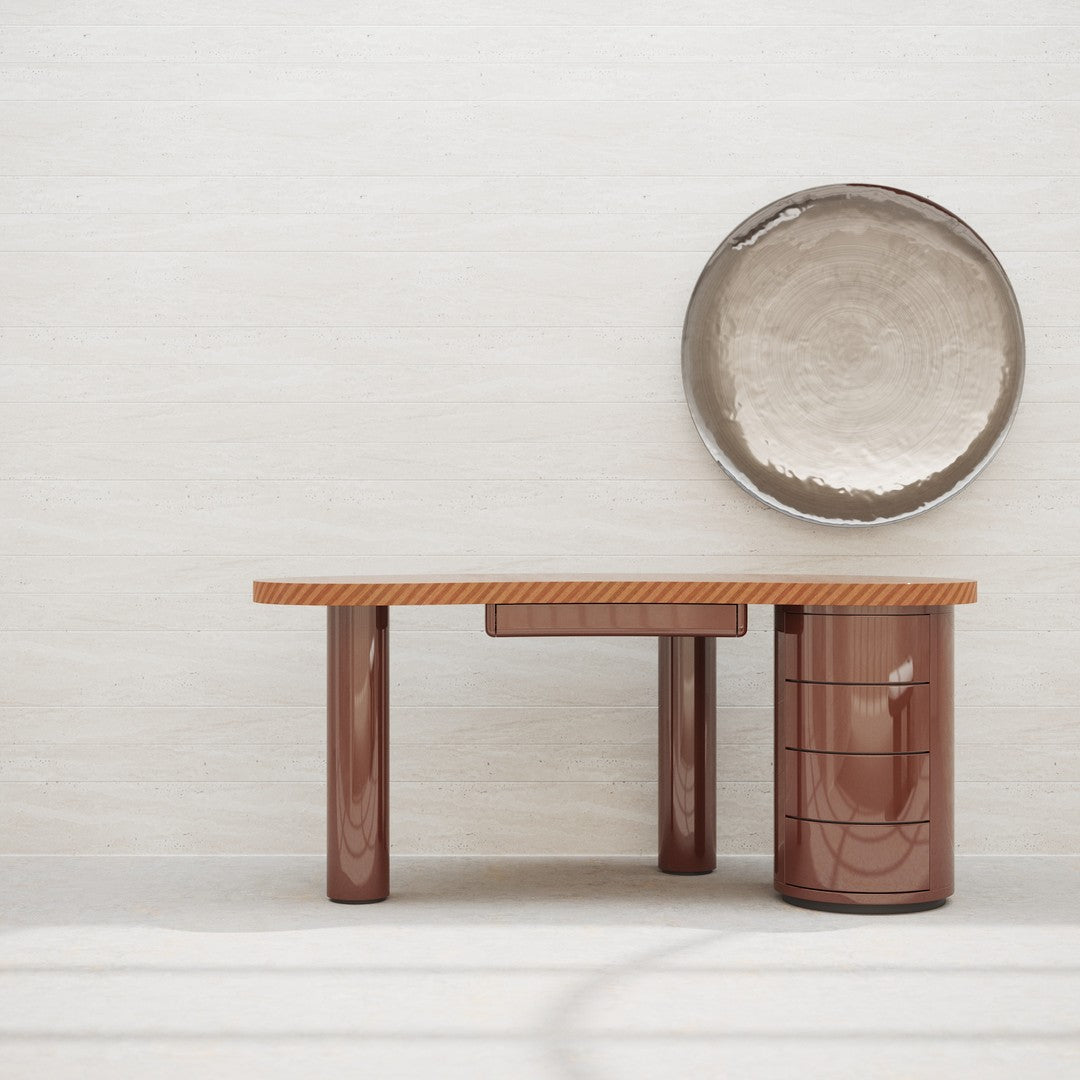 Modern brown geometric table with textured wood surface and glossy cylindrical legs, paired with a metallic bowl.
