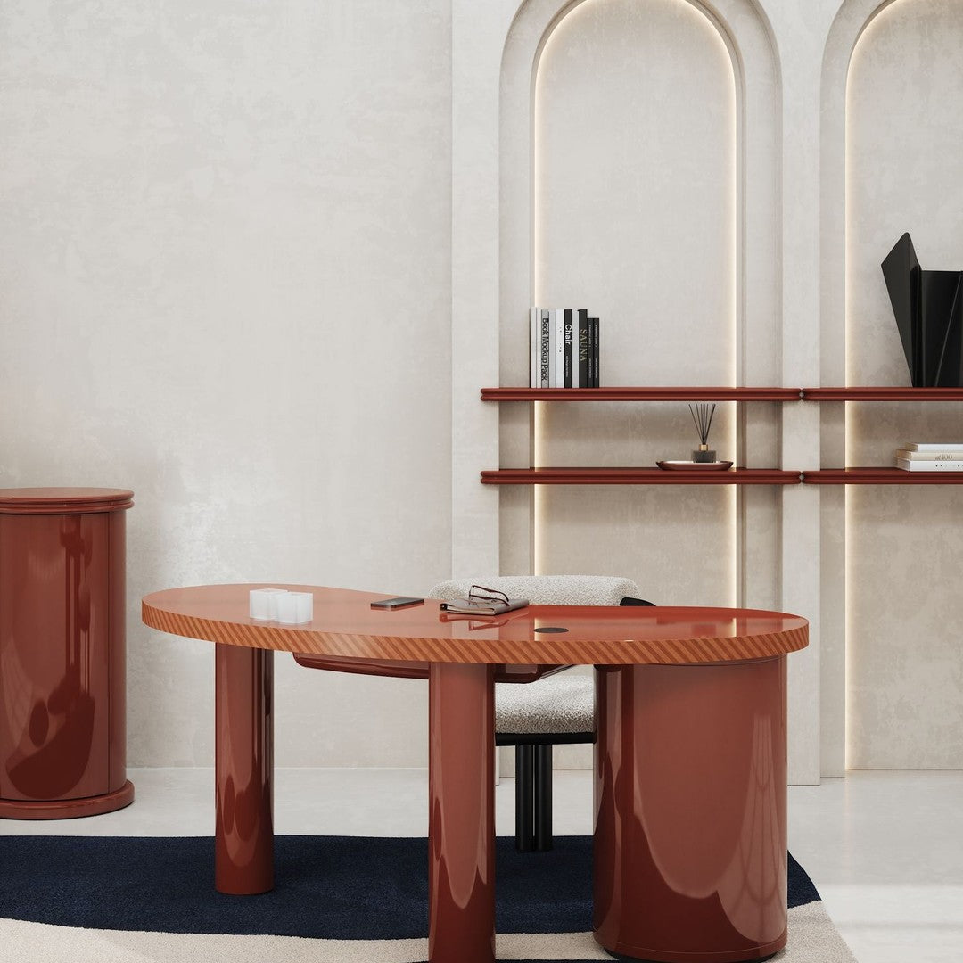 Glossy terracotta desk with a diamond pattern and sleek, modern silhouette, complemented by a dark blue rug.