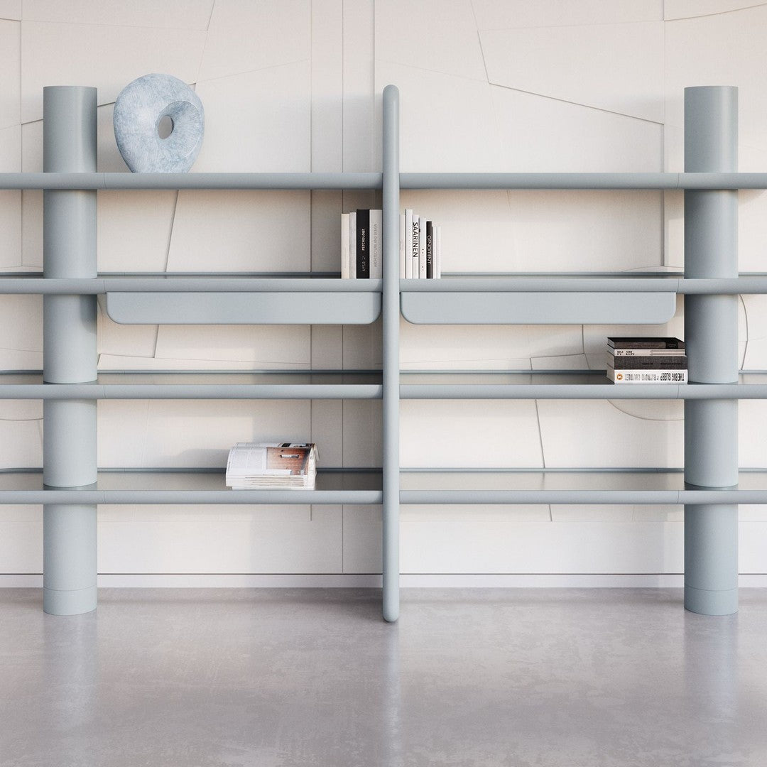 Light blue modern shelving unit with smooth, rounded edges and minimalist design, featuring open shelves and subtle patterns.