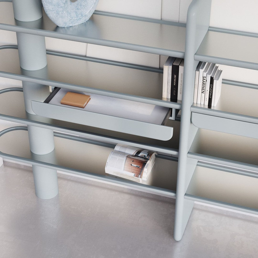 Modern gray shelving unit with sleek lines and minimalist design, featuring a light gray finish and subtle textures.