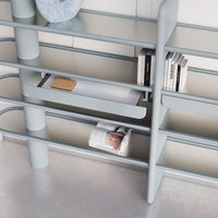 Modern gray shelving unit with sleek lines and minimalist design, featuring a light gray finish and subtle textures.
