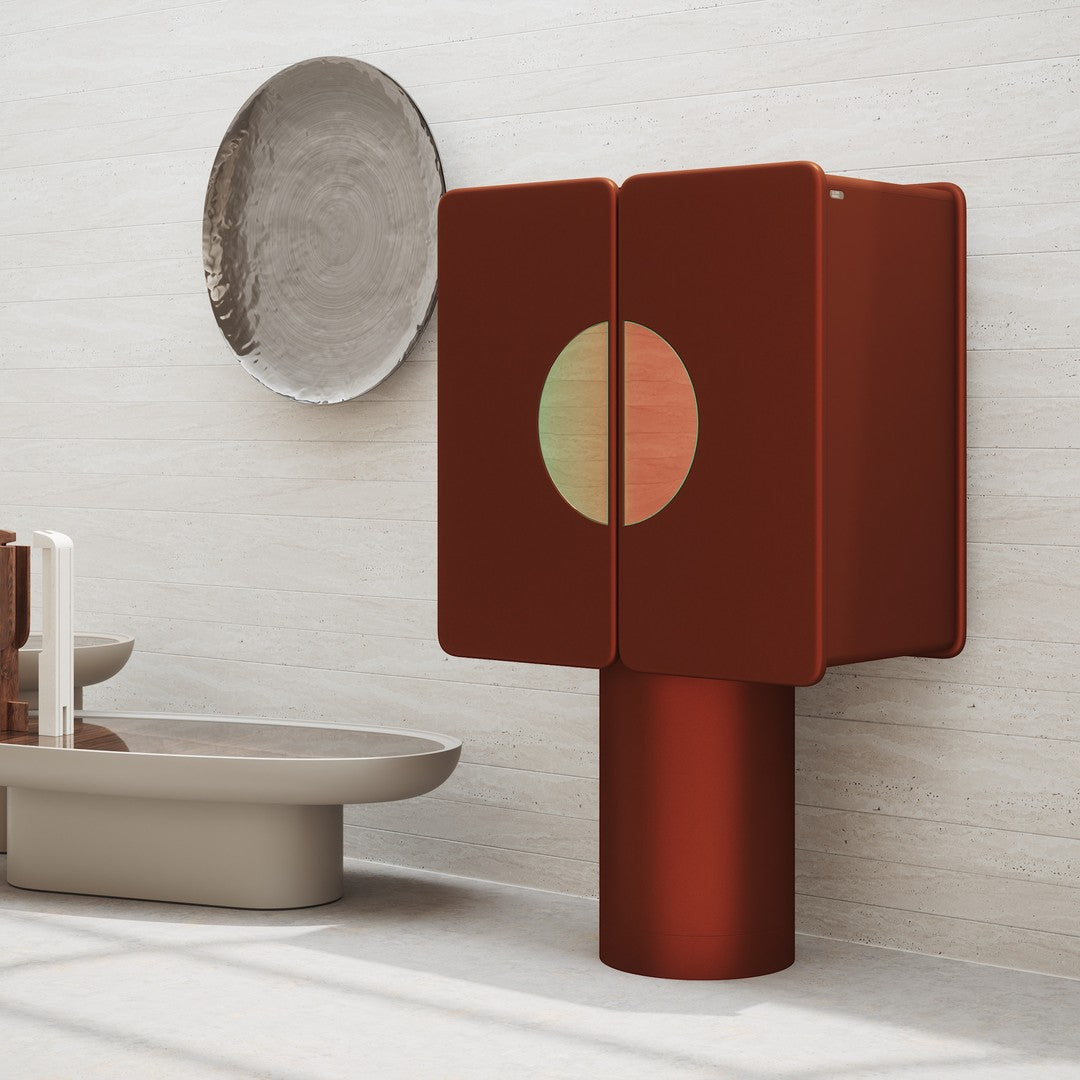 Modern two-door cabinet in deep red with a circular design, complemented by muted beige tones in the background.
