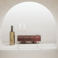 Stylish burgundy and gold decor with smooth textures, set against a soft beige backdrop and subtle linear patterns.