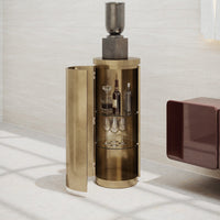 Elegant gold bar cabinet with sleek design, featuring a shiny exterior and glass shelves, perfect for modern decor.