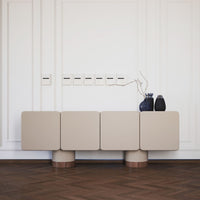 Beige square sideboard with wood accents, featuring a smooth, modern design against a light wall and wooden floor.