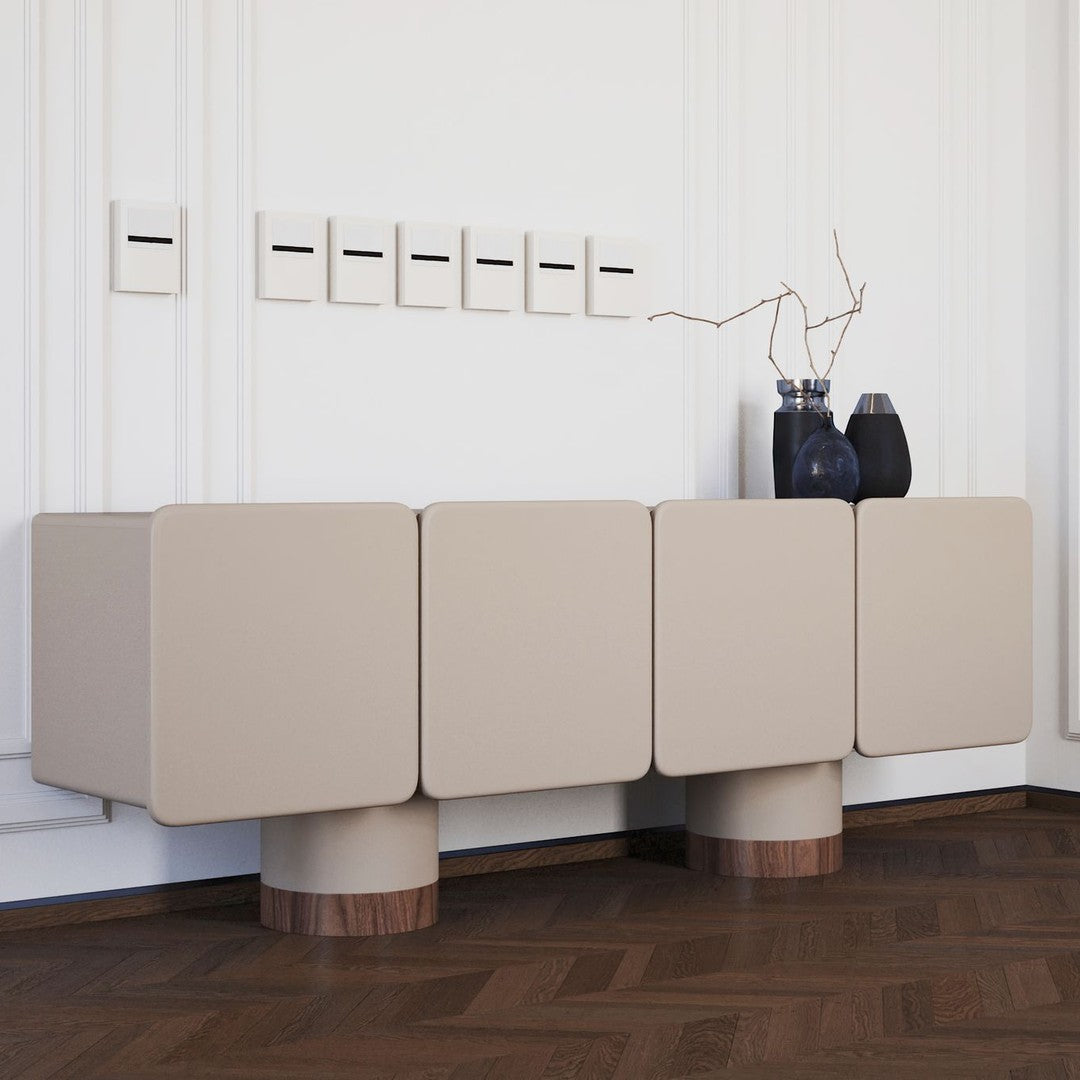 Beige modern console table with smooth surfaces and rounded wood legs, featuring a minimalist design.