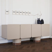 Beige modern console table with smooth surfaces and rounded wood legs, featuring a minimalist design.