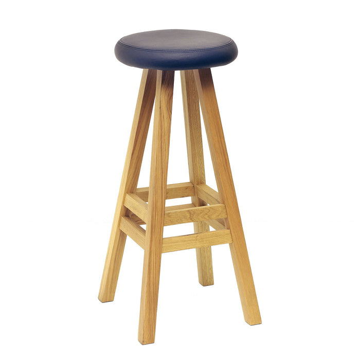 Modern wooden bar stool with a natural finish and dark blue padded seat, featuring a sleek, minimalist design.