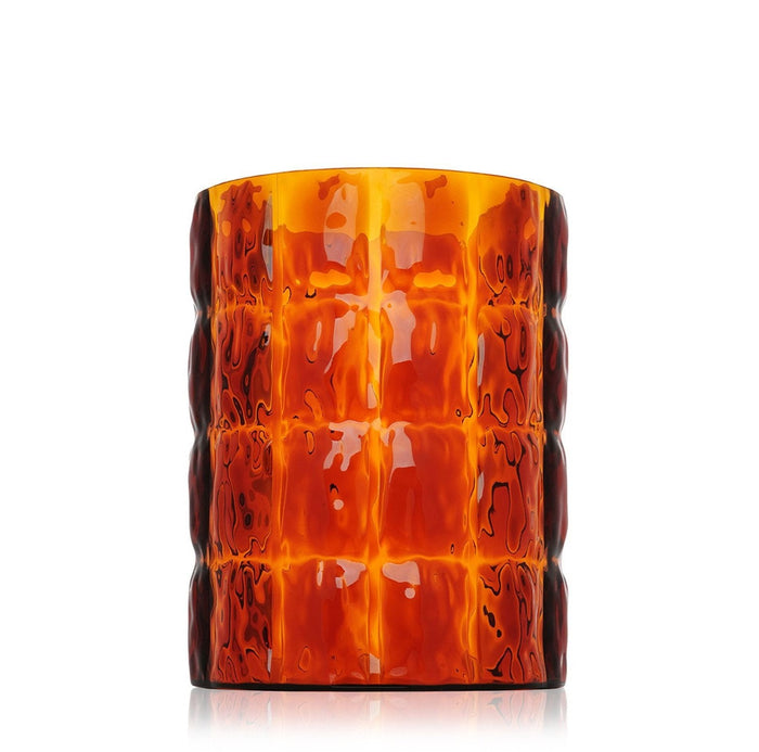 Amber glass candle holder with a textured, ribbed pattern. Features warm orange and brown hues for a cozy look.