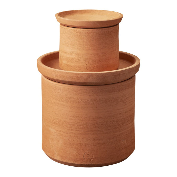 Terra cotta pot set with smooth, earthy tones and minimalist design, featuring a stacked, circular pattern.