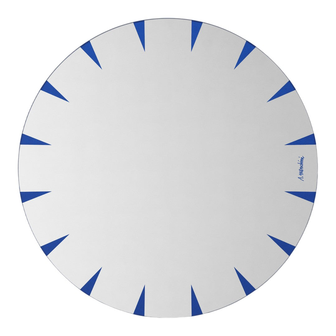 Round white plate featuring vibrant blue triangular patterns along the edge.