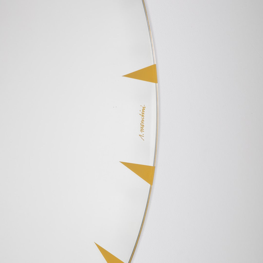 White surface with minimalist gold triangle patterns, creating an elegant and modern design.