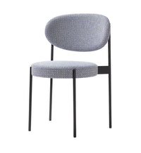 Blue and gray patterned upholstered chair with a sleek black metal frame. Ideal for modern interiors.