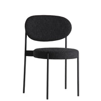 Black fabric dining chair with a sleek design and round cushions, featuring a matte black metal frame.