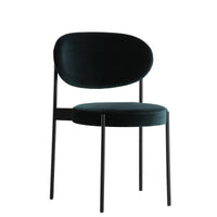 Stylish dark green velvet chair with a sleek black metal frame, perfect for modern decor. Cozy and elegant design.