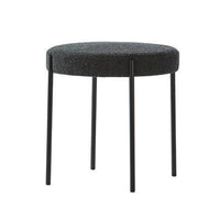 Round gray upholstered stool with black legs, featuring a textured finish and minimalist design. Ideal for modern decor.