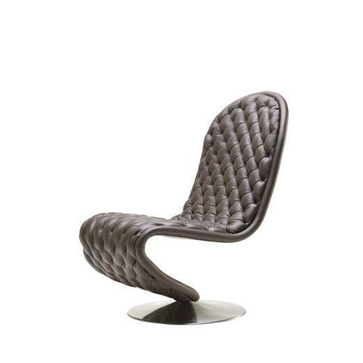 Modern brown quilted lounge chair with a sleek silver base, featuring a stylish, curvy design. Perfect for contemporary decor.