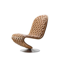 Brown woven leather chair with a sleek ergonomic design and a silver metal base. Perfect for modern interiors.