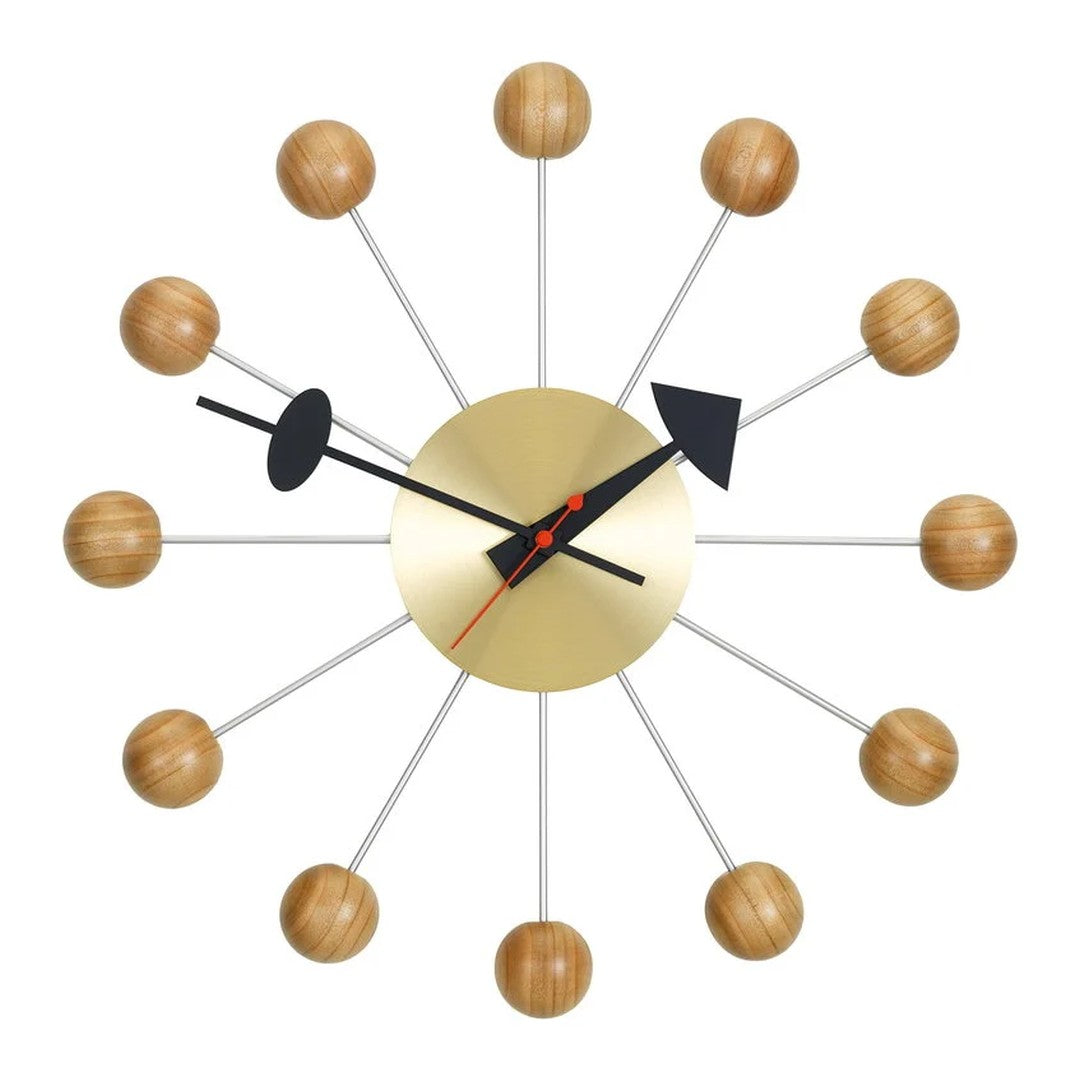 Mid-century modern wall clock with gold, black, and natural wood accents, featuring a radial design and sleek lines.