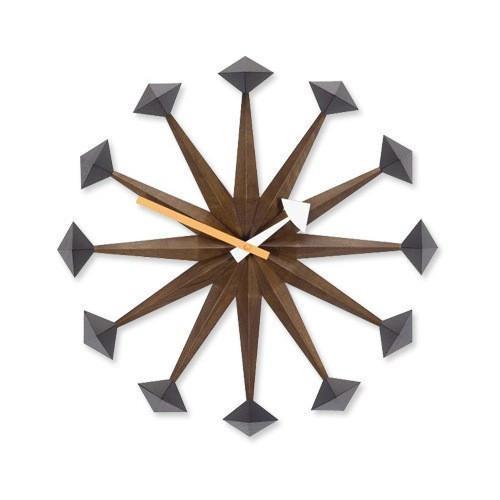 Mid-century modern wall clock featuring brown, black, and gold tones with geometric starburst design.