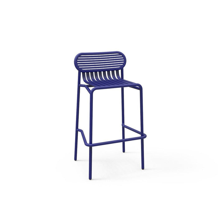 Vibrant blue metal bar stool with slatted backrest, perfect for modern decor.