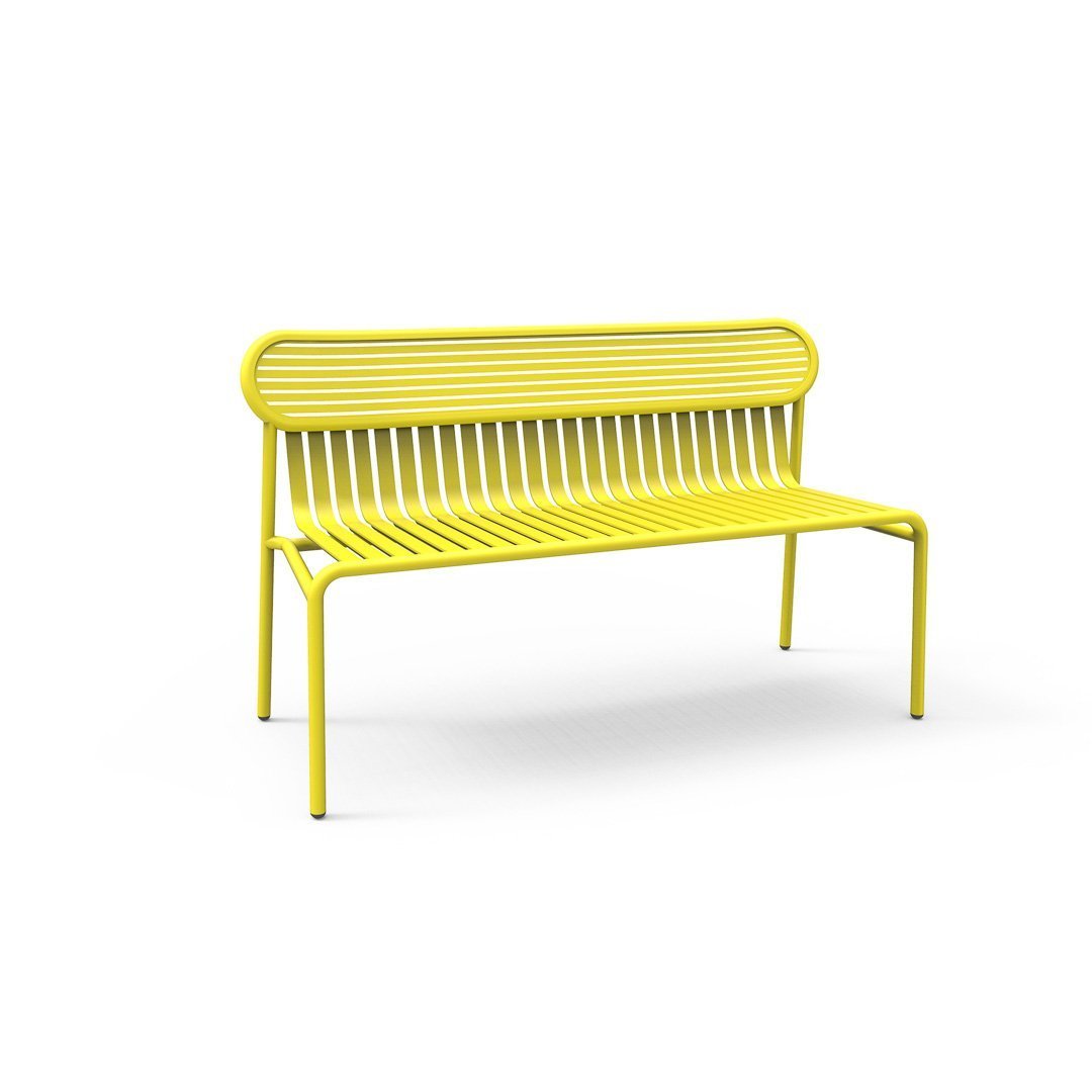 Bright yellow metal bench with sleek, vertical slat design perfect for outdoor or modern interiors.