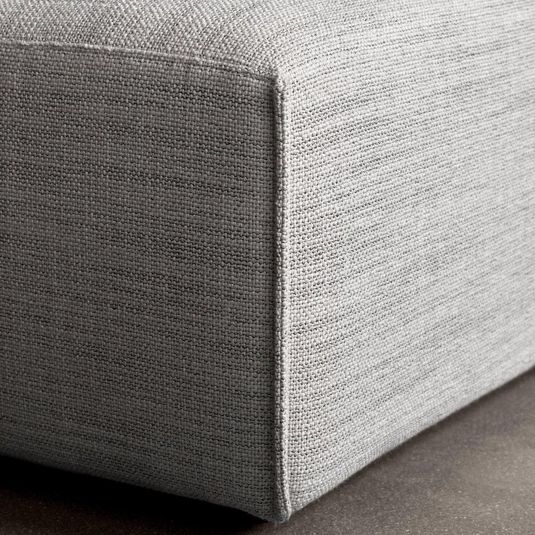 Gray textured fabric with a subtle woven pattern, showcasing a modern and minimalist design.