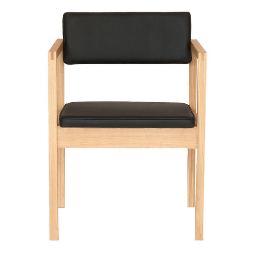 Black faux leather seat and backrest with natural wood frame, minimalist design, modern aesthetic.