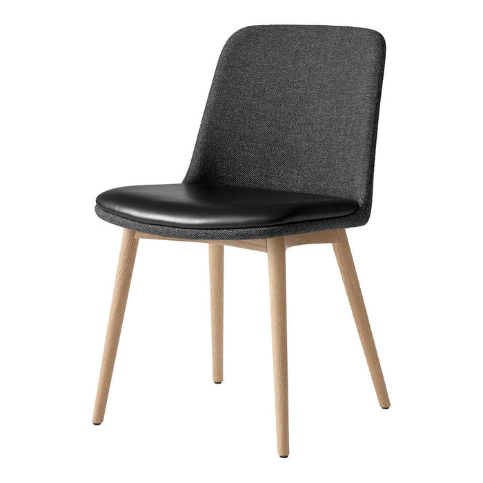 Gray upholstered chair with a black seat and natural wood legs, featuring a minimalist design.
