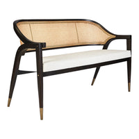 "Elegant black and natural wicker bench with creamy white upholstery and gold accents."