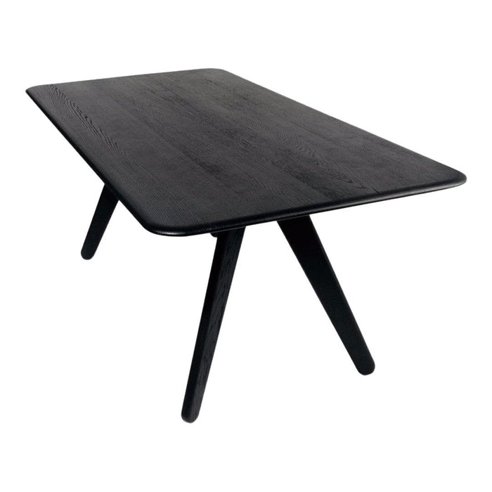Black wooden dining table with a smooth surface and sleek, angled legs for a modern look.