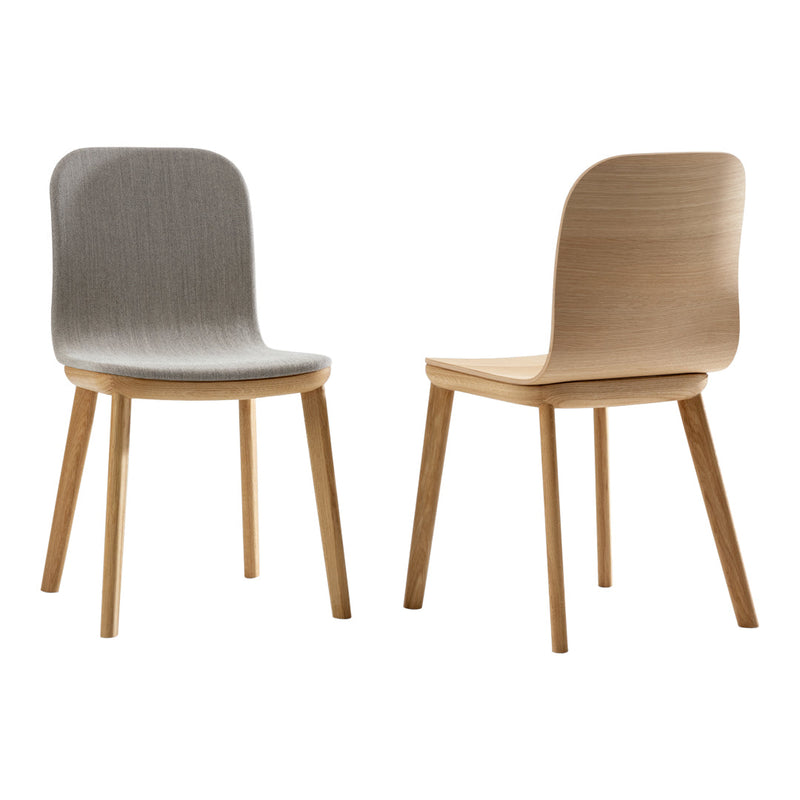 Gray textured chair and light wood chair, sleek design, simple patterns and natural colors for modern decor.