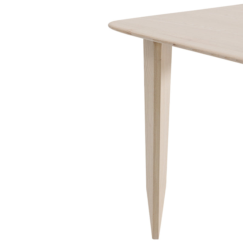 Light wood table with a smooth, natural finish and tapered legs, showcasing a minimalist design.