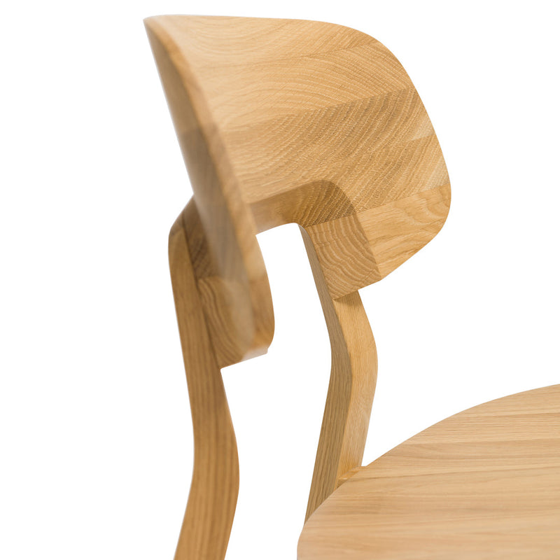 Natural wood chair in light oak finish with smooth, curved lines and a minimalist design. Ideal for modern decor.